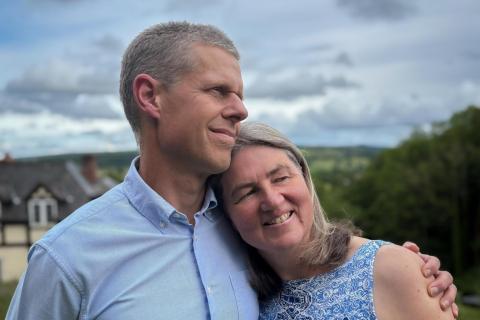 Couple holding each other in front of natural view