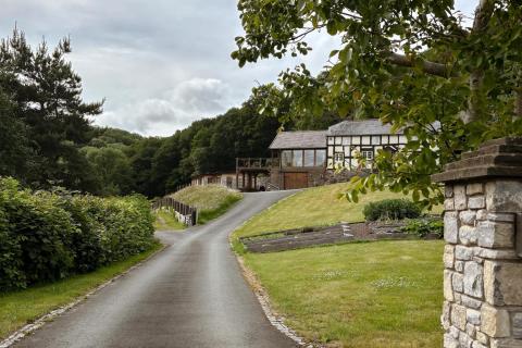View of timber-frame house through sturdy wall